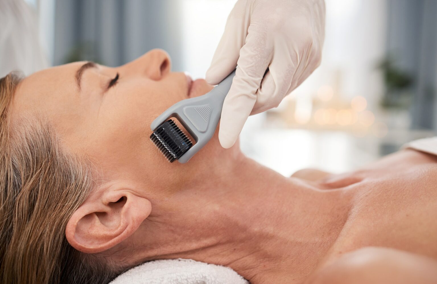 Closeup shot of a mature woman enjoying a micro-needling treatment at a spa